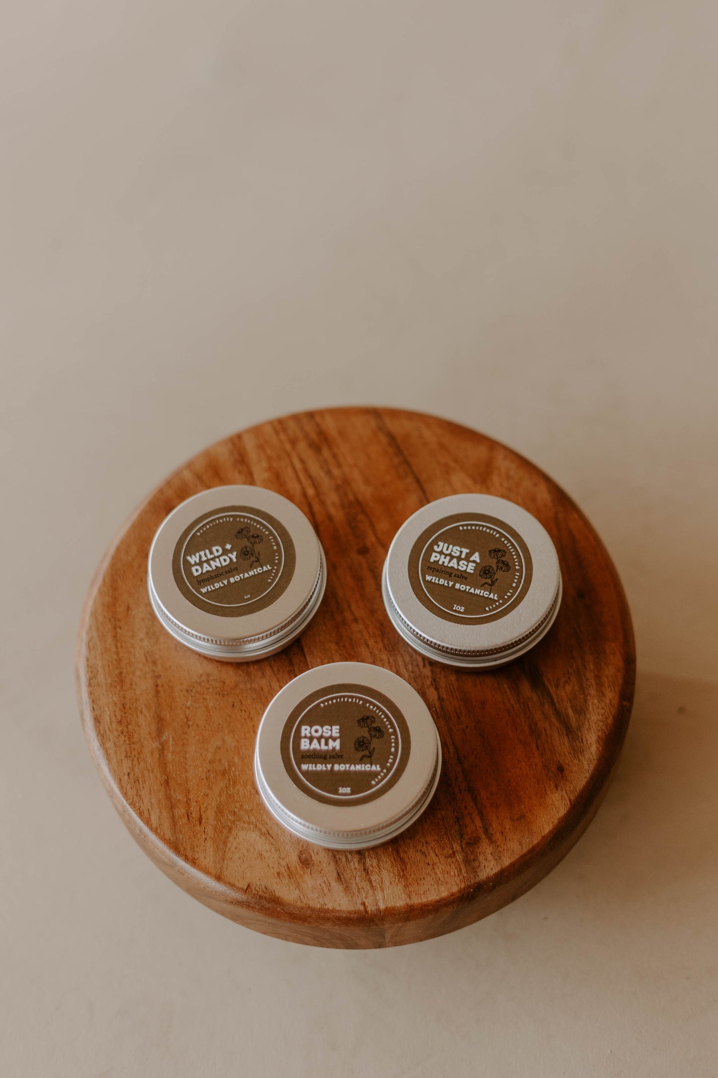 wooden stand, wild + dandy balm, salve, tin, just a phase balm, rose balm